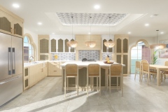 A spacious, Mediterranean-inspired kitchen featuring light wood cabinetry, woven pendant lights, arched windows, and a large island with cane-back barstools beneath a patterned recessed ceiling.