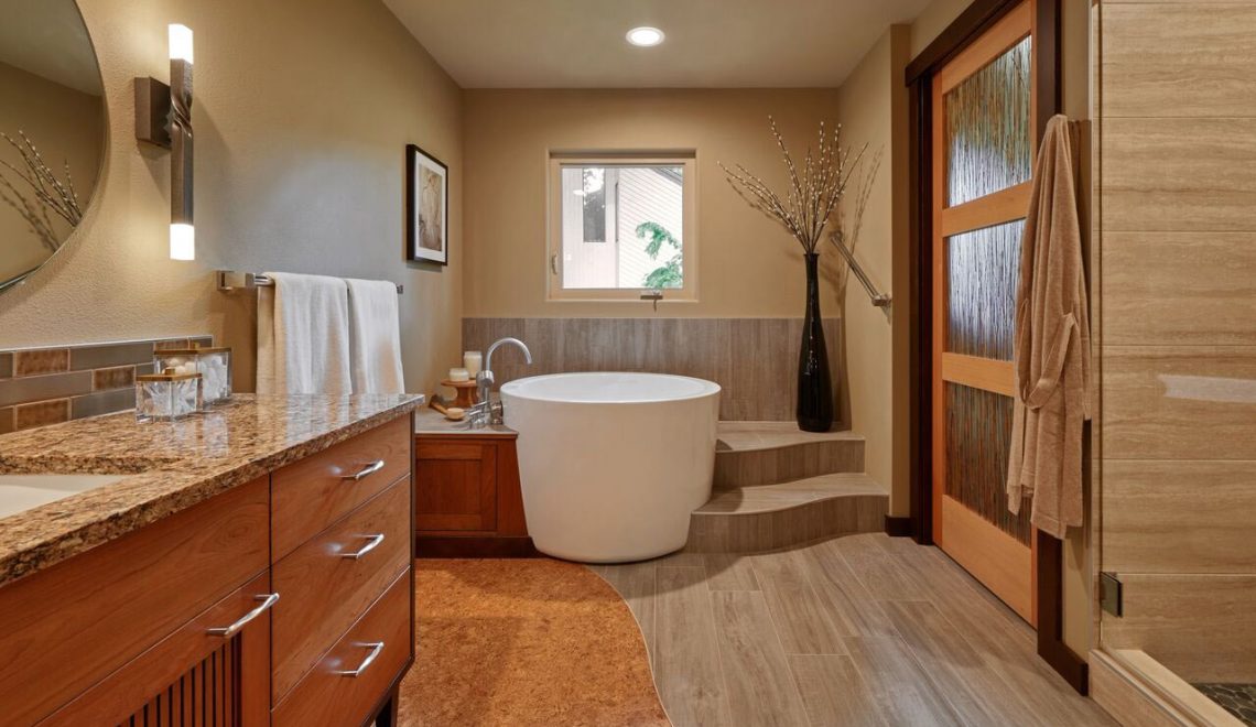 Natural spa bathroom with steps wrapped around freestanding tub