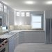 L-shaped kitchen with blue walls, white cabinets and a custom back splash.