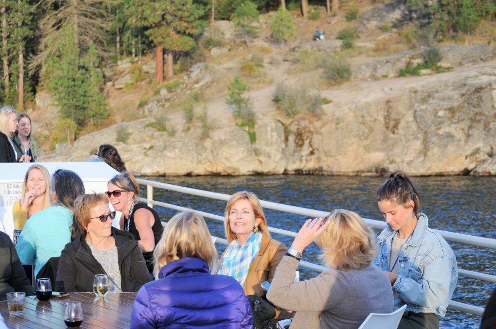 Group of people enjoying lake cruise on Coeur d' Alene Lake