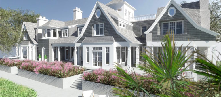 A large gray coastal-style home with multiple gables, white trim, and landscaped planters filled with pink flowers along the front steps and walkway.